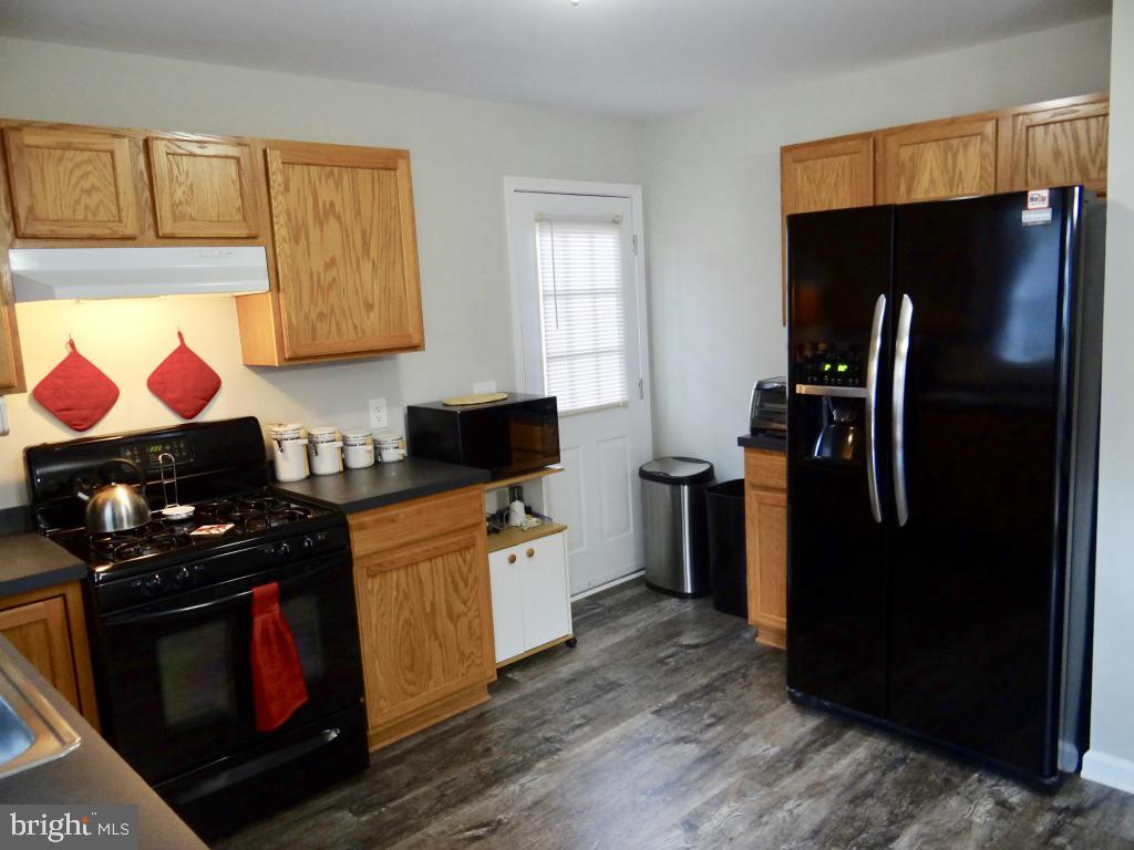 126 Green Street Mount Holly, NJ 08060 - Photo 9 of 41 a kitchen with a refrigerator stove and microwave