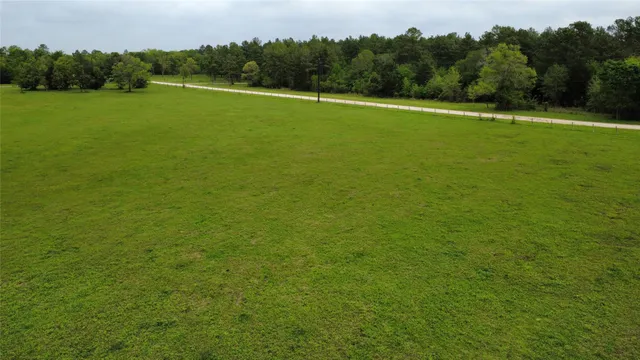 a view of a field with a big yard