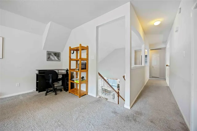 a view of a hallway with workspace