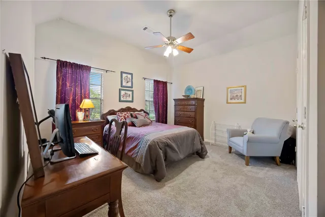 a bed room with bed and a flat screen tv