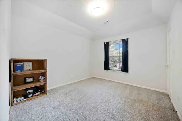 a view of an empty room with shelves