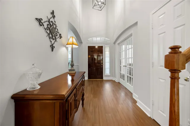 a view of entryway and hall with wooden floor