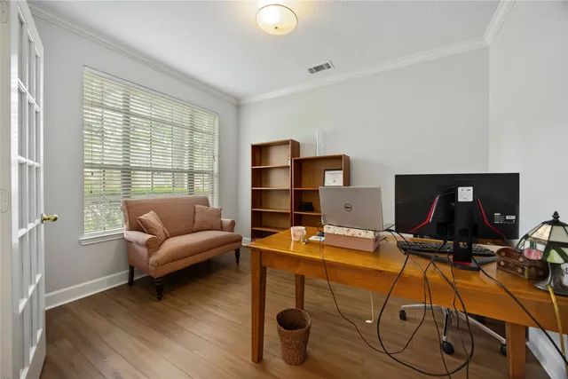 a room with furniture and a wooden floor
