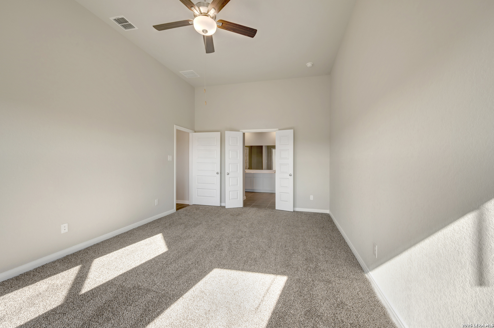 10330 Goodison Drive Converse, TX 78109 - Photo 20 of 42 a view of an empty room with a chandelier fan