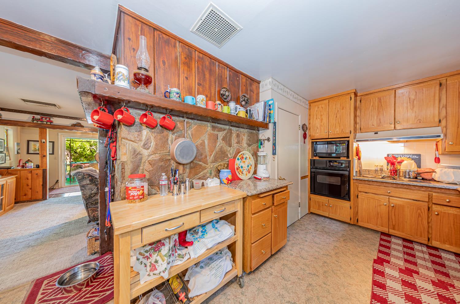 42585 Buckeye Road Oakhurst, CA 93644 - Photo 11 of 55 a kitchen with stainless steel appliances and cabinets