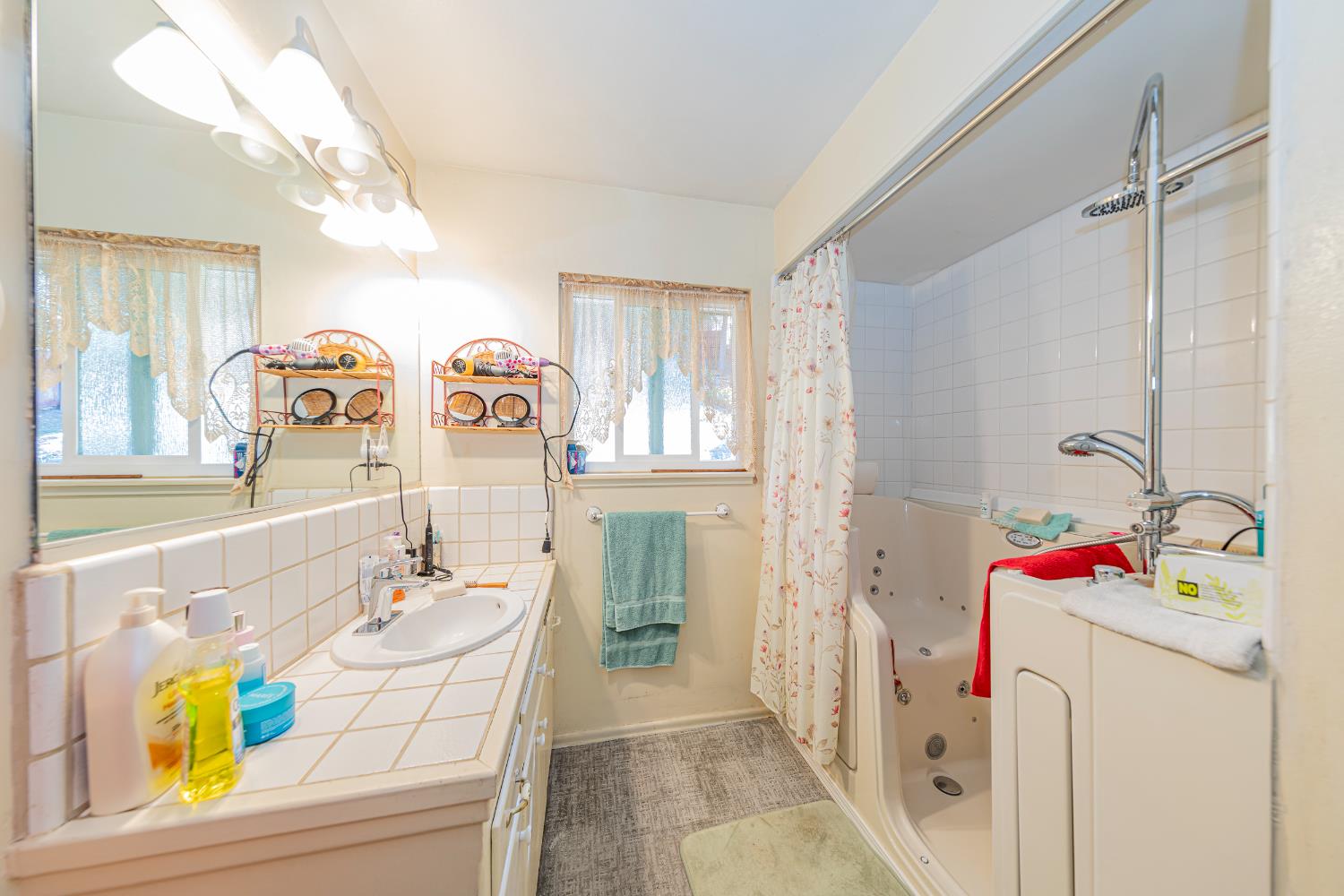 42585 Buckeye Road Oakhurst, CA 93644 - Photo 17 of 55 a bathroom with a sink mirror and vanity