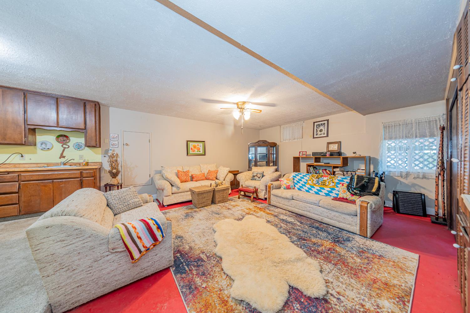 42585 Buckeye Road Oakhurst, CA 93644 - Photo 23 of 55 a living room with furniture fireplace and a rug