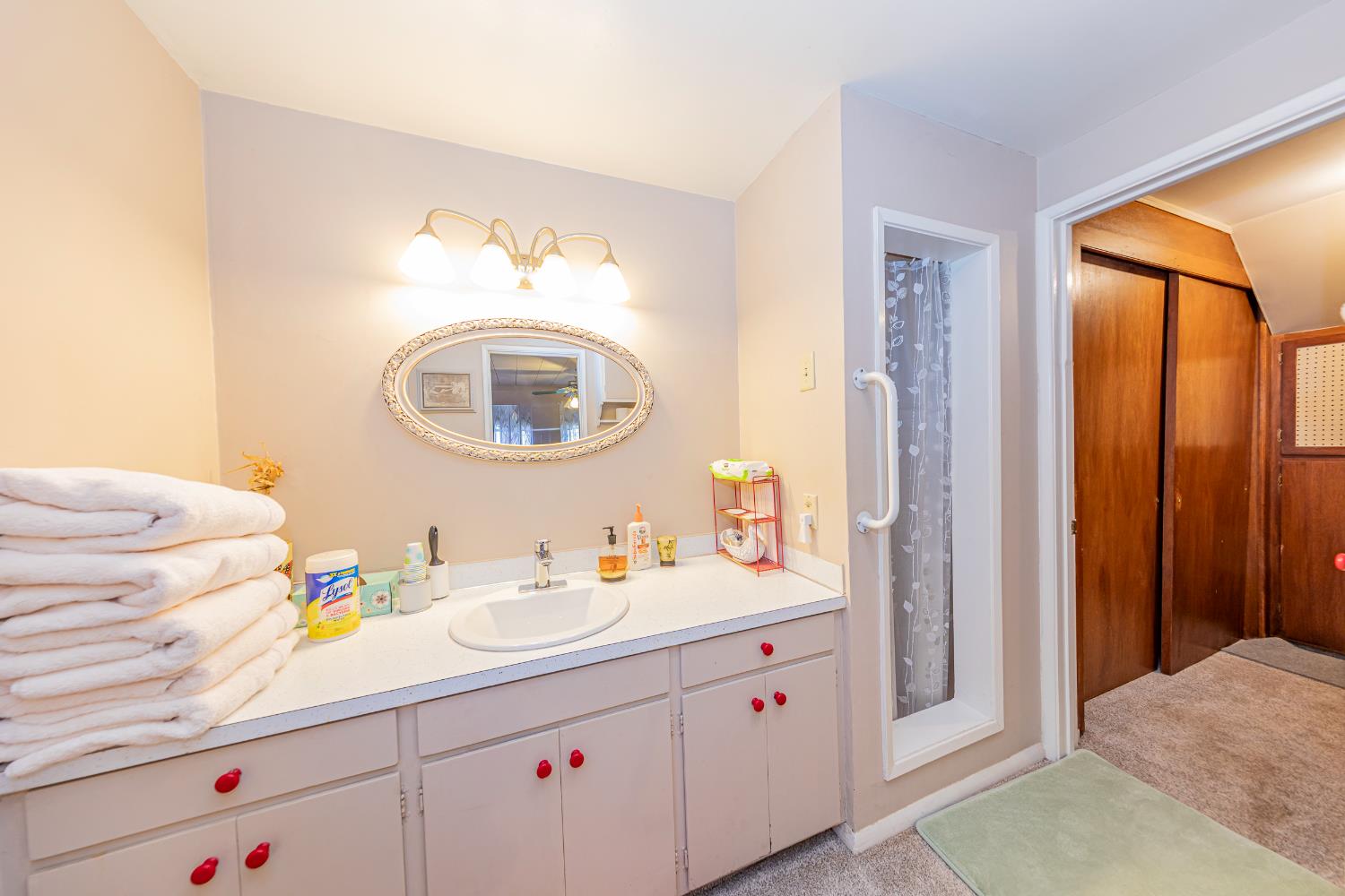 42585 Buckeye Road Oakhurst, CA 93644 - Photo 30 of 55 a bathroom with a double vanity sink and a mirror