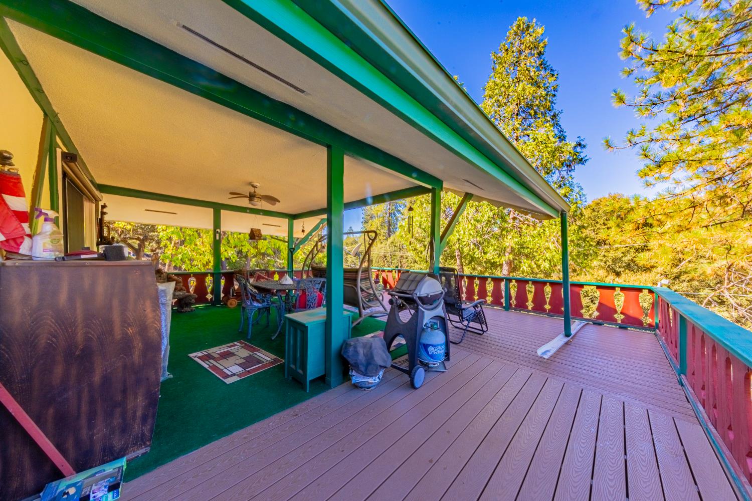 42585 Buckeye Road Oakhurst, CA 93644 - Photo 38 of 55 a view of a deck with wooden floor and outdoor seating