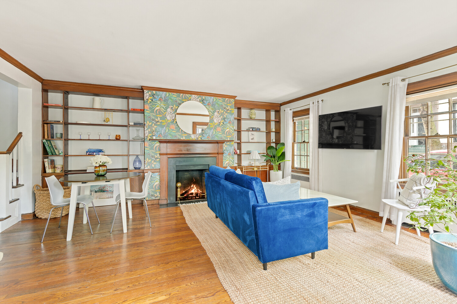 24 Middagh Street Brooklyn, NY 11201 - Photo 26 of 34 a living room with furniture a flat screen tv and a fireplace