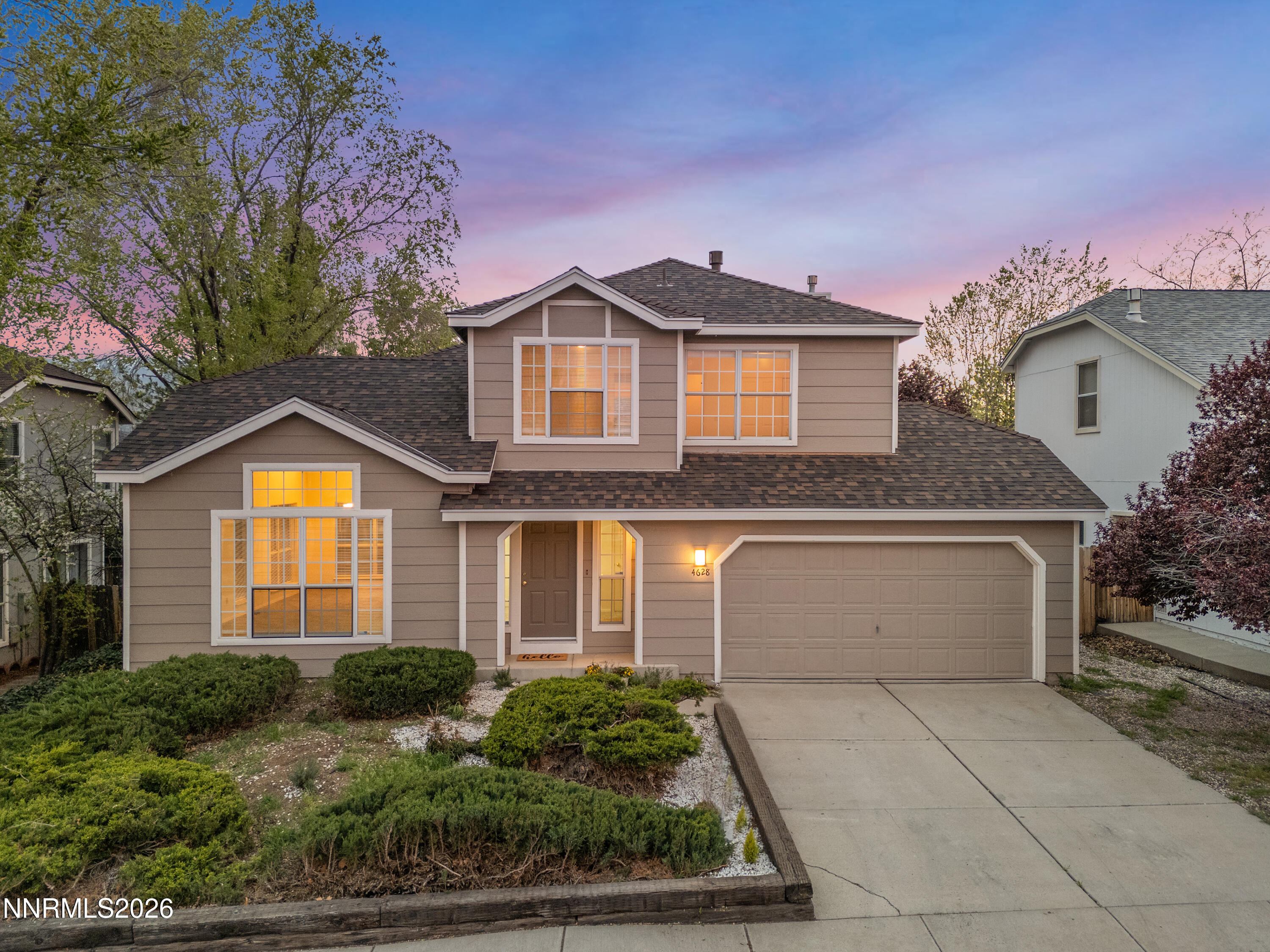 4628 Windcrest Drive Reno, NV 89523 - Photo 1 of 38 a front view of a house with a yard and garage