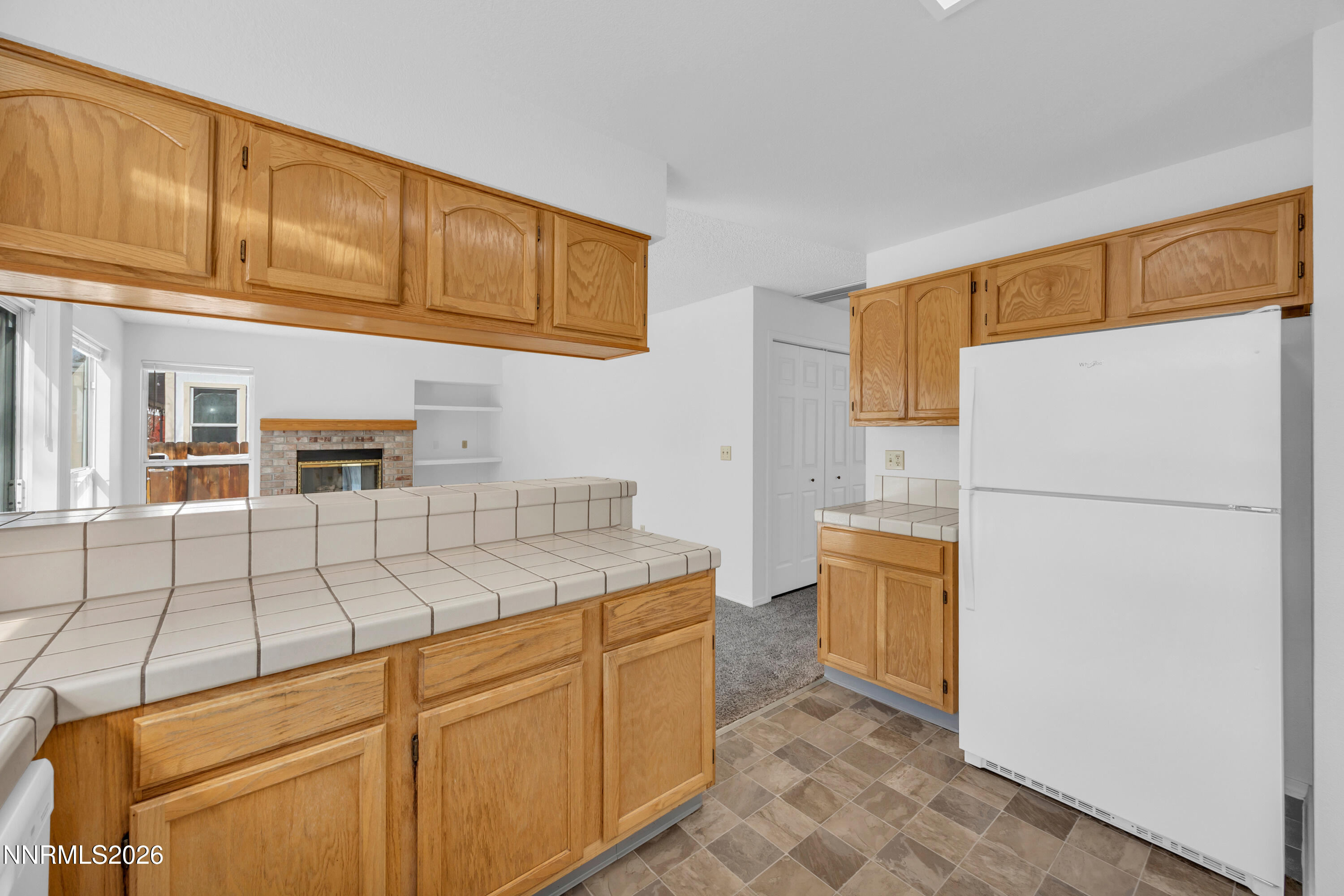 4628 Windcrest Drive Reno, NV 89523 - Photo 13 of 38 a kitchen with stainless steel appliances granite countertop a refrigerator a stove a sink and dishwasher