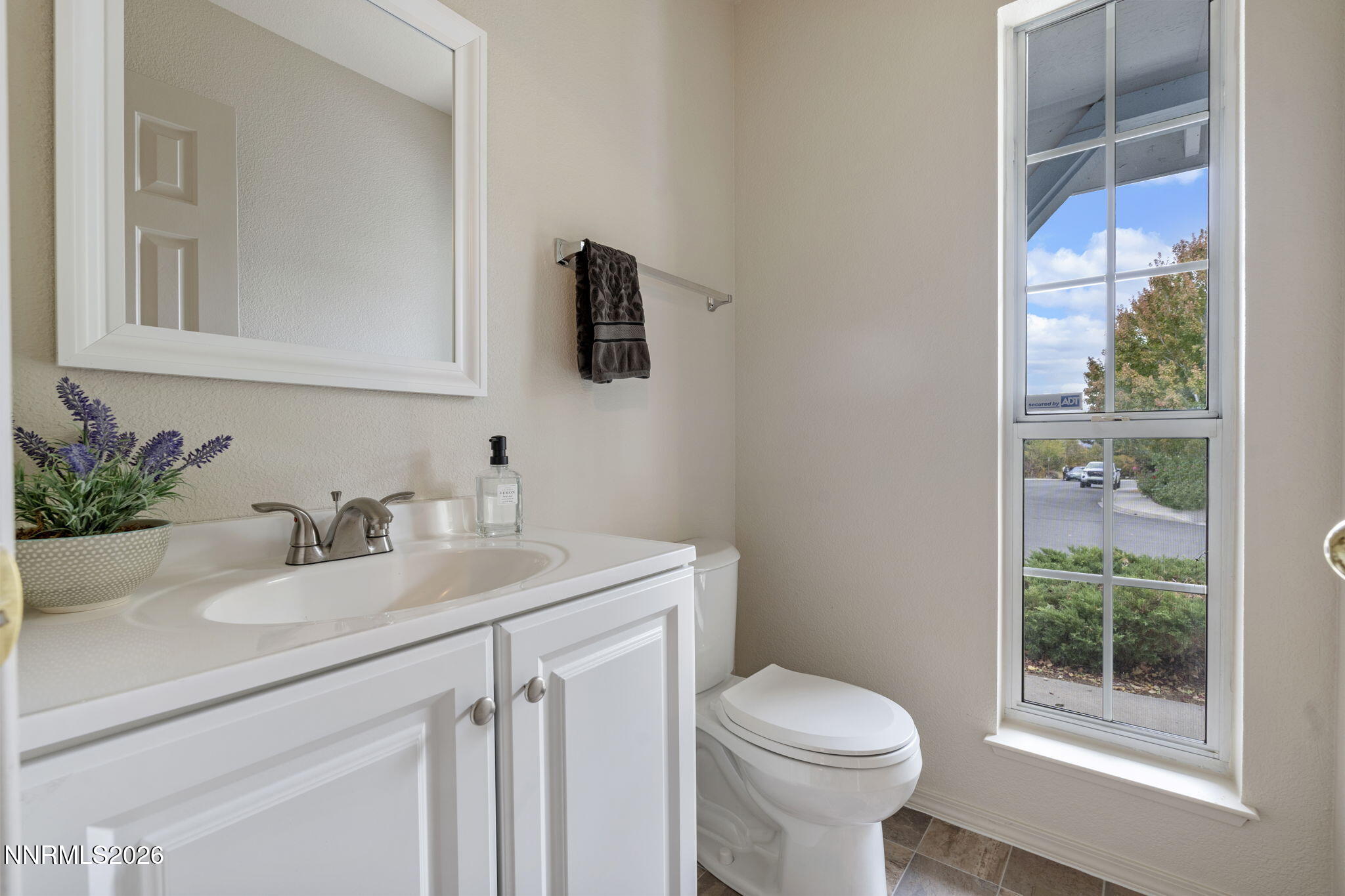 4628 Windcrest Drive Reno, NV 89523 - Photo 19 of 38 a bathroom with a sink toilet and a mirror