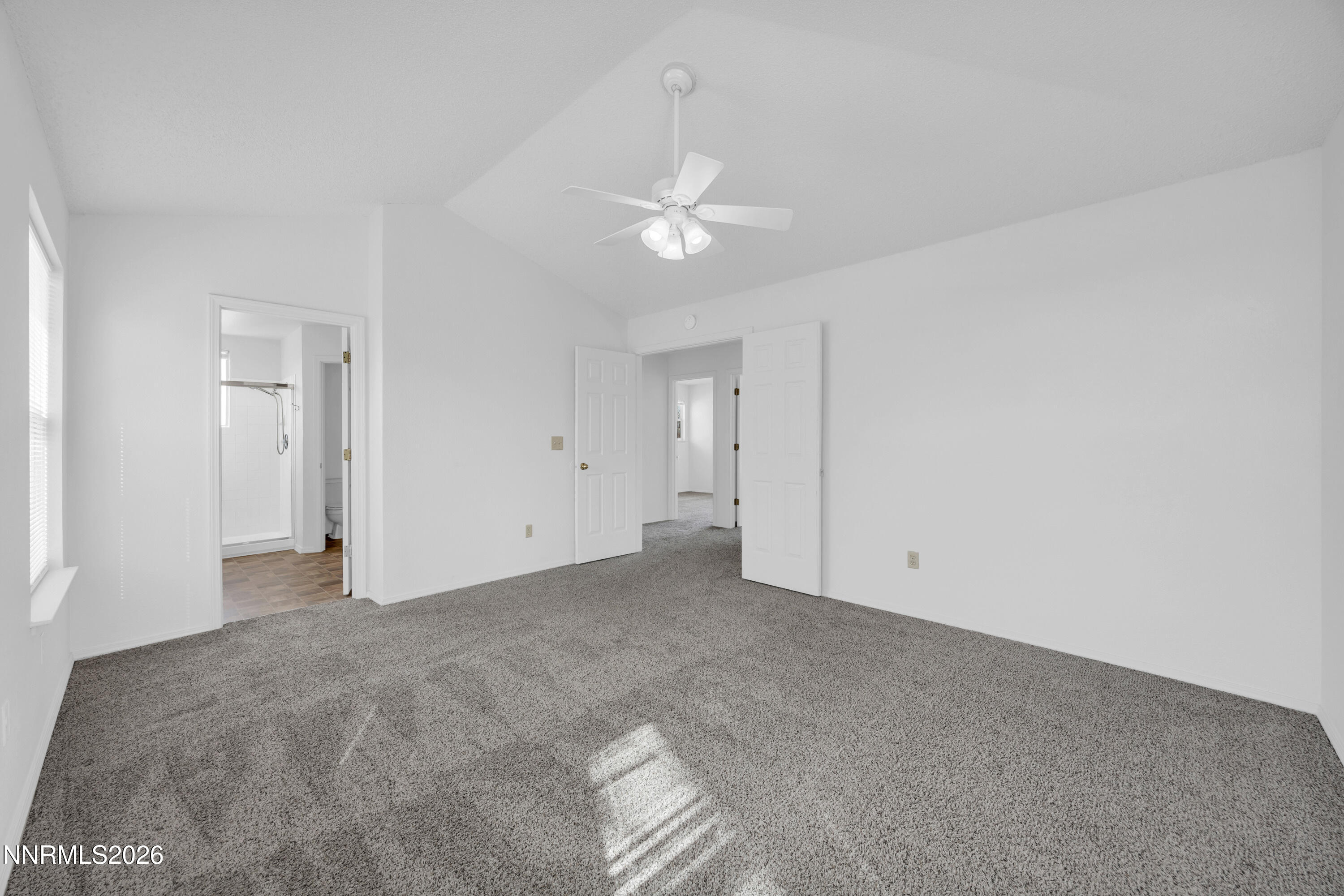 4628 Windcrest Drive Reno, NV 89523 - Photo 22 of 38 a view of an empty room with a ceiling fan