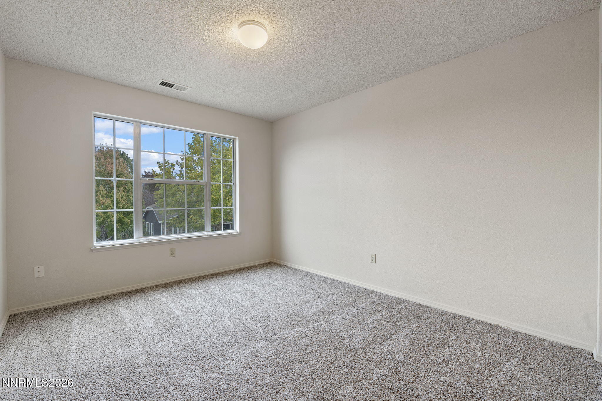 4628 Windcrest Drive Reno, NV 89523 - Photo 24 of 38 an empty room with a window