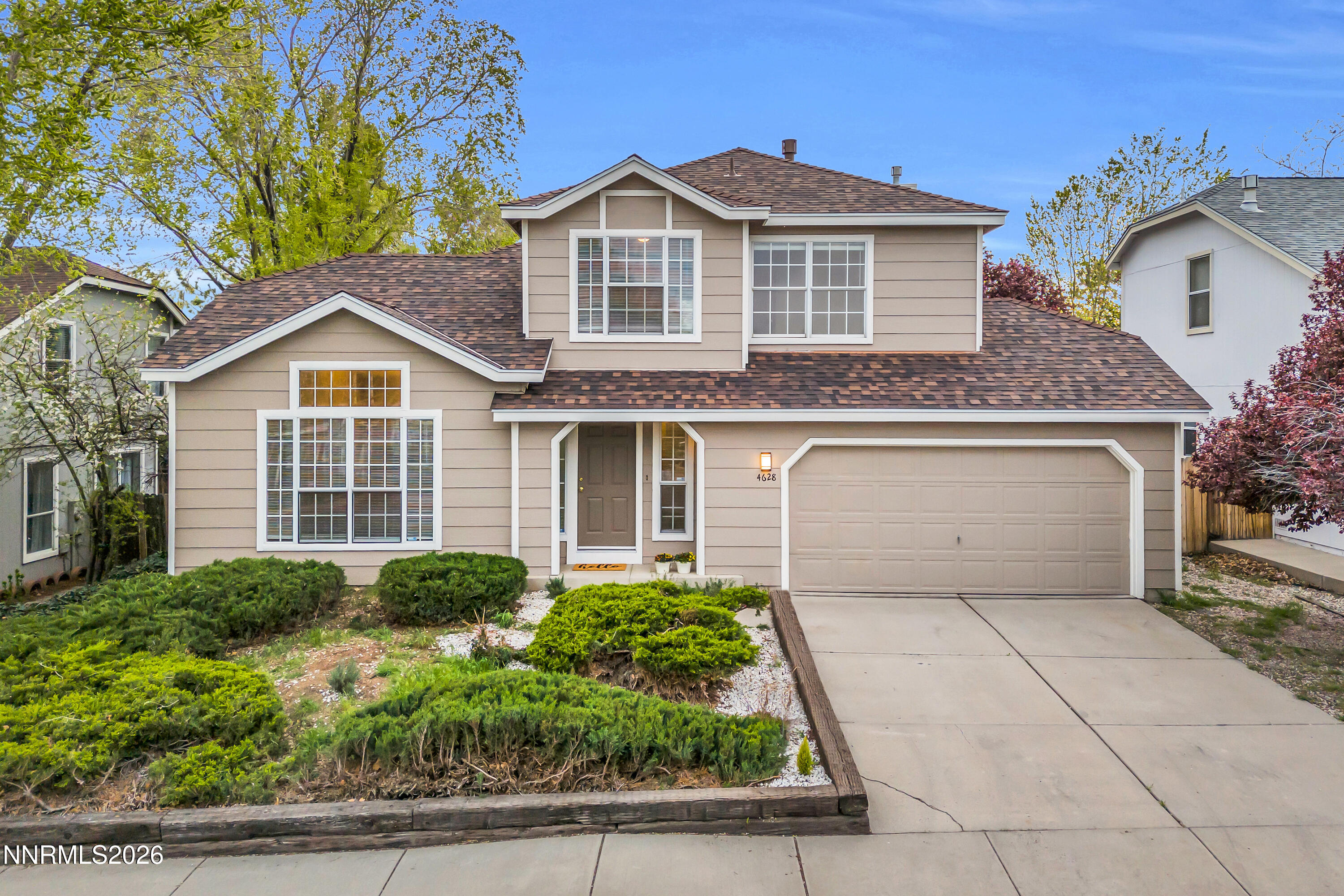 4628 Windcrest Drive Reno, NV 89523 - Photo 32 of 38 a front view of a house with a garden