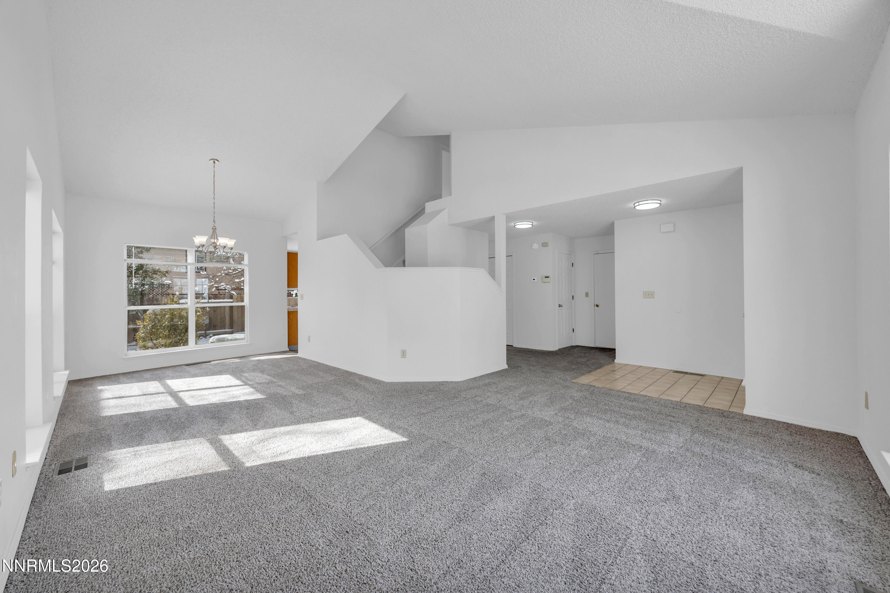 4628 Windcrest Drive Reno, NV 89523 - Photo 8 of 38 a view of a livingroom with furniture and chandelier