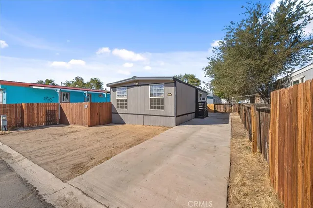 a backyard of a house with wooden floor