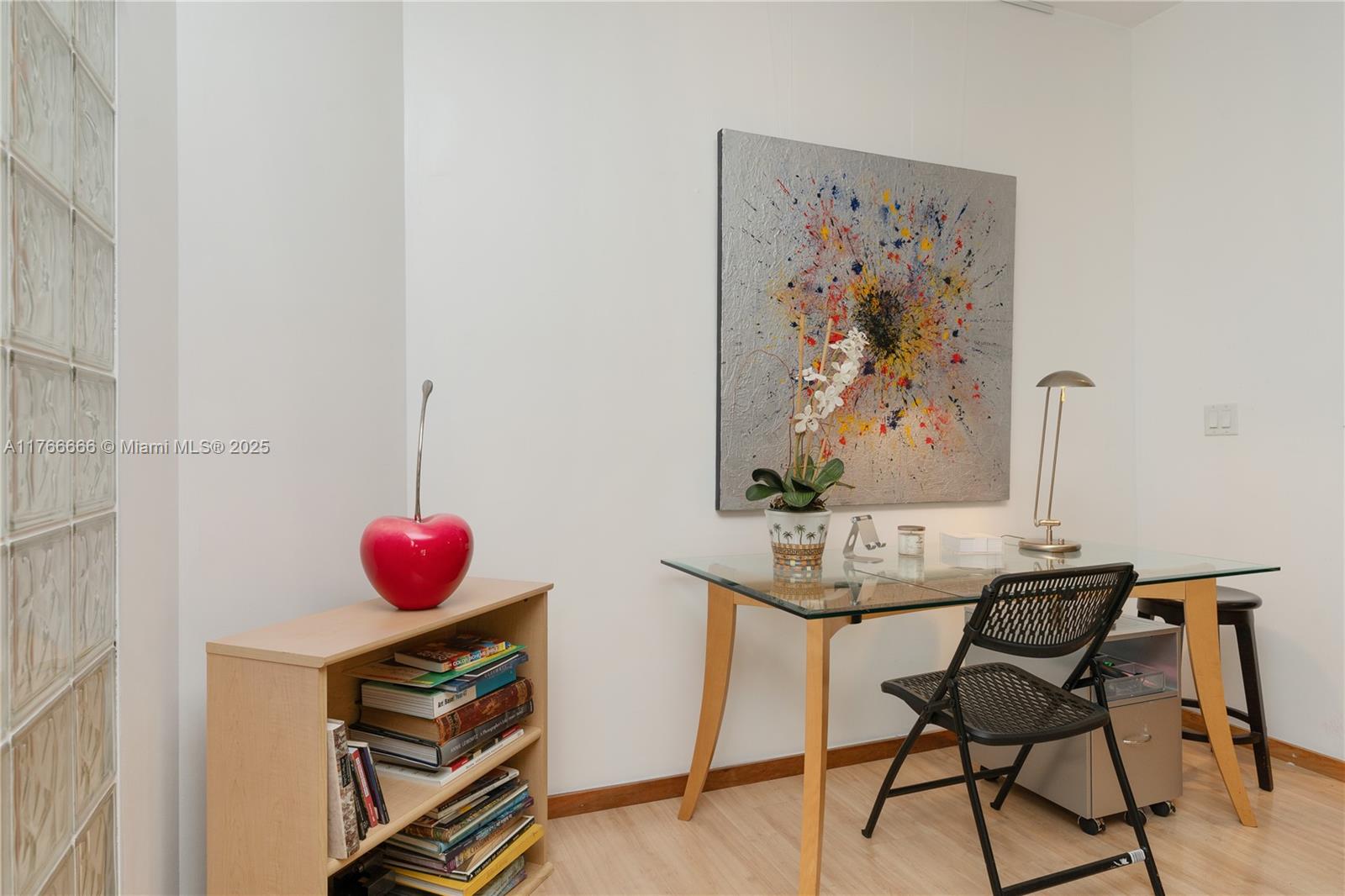 3333 Rice Street, Unit 202 Miami, FL 33133 - Photo 13 of 36 a view of a room with a table and chairs