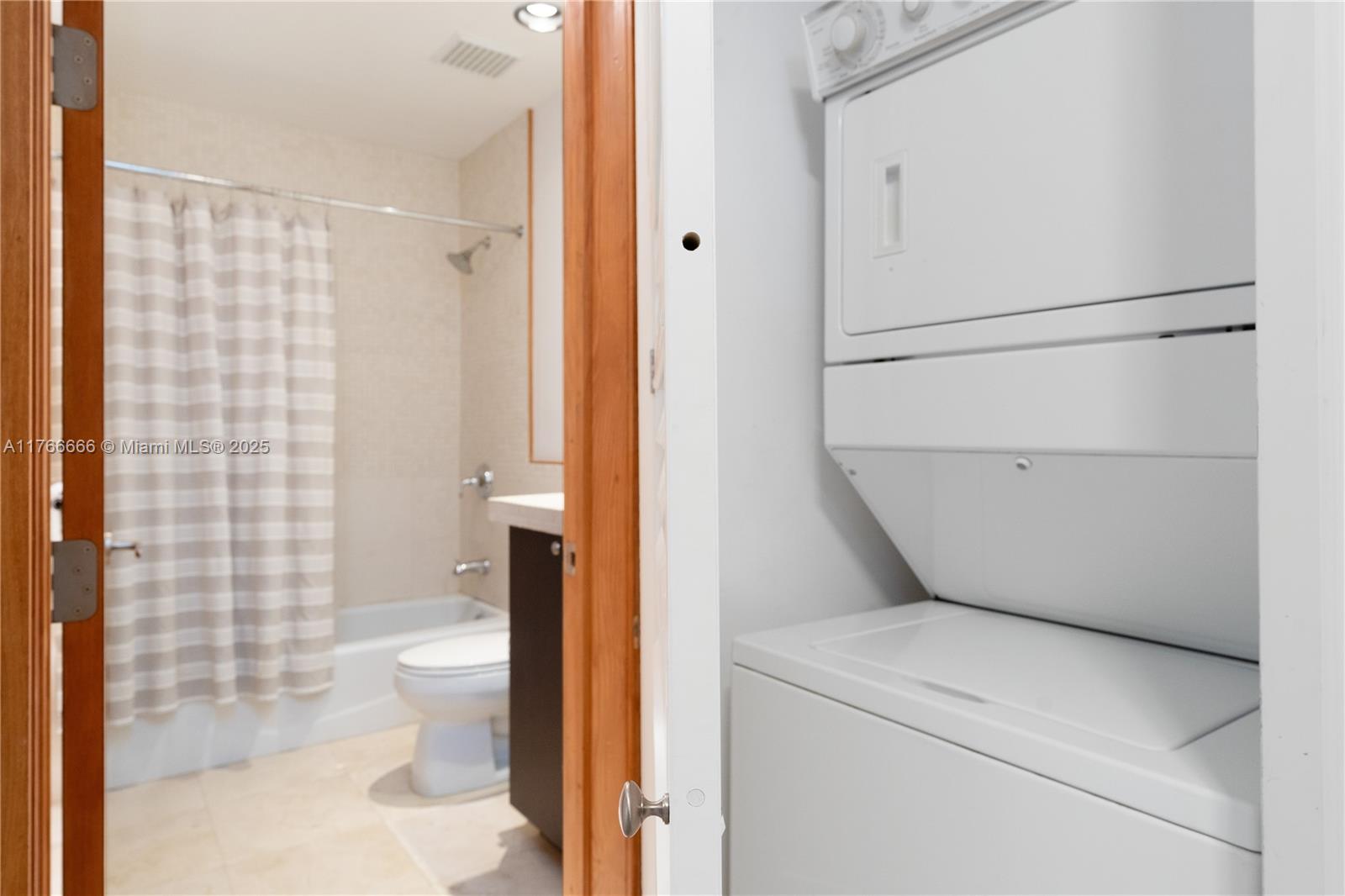 3333 Rice Street, Unit 202 Miami, FL 33133 - Photo 19 of 36 a bathroom with a toilet and a shower