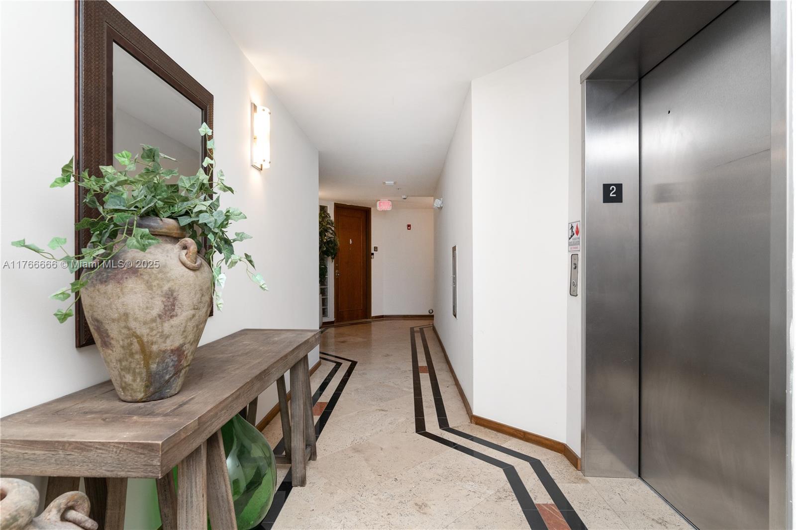 3333 Rice Street, Unit 202 Miami, FL 33133 - Photo 29 of 36 a view of hall way with furniture