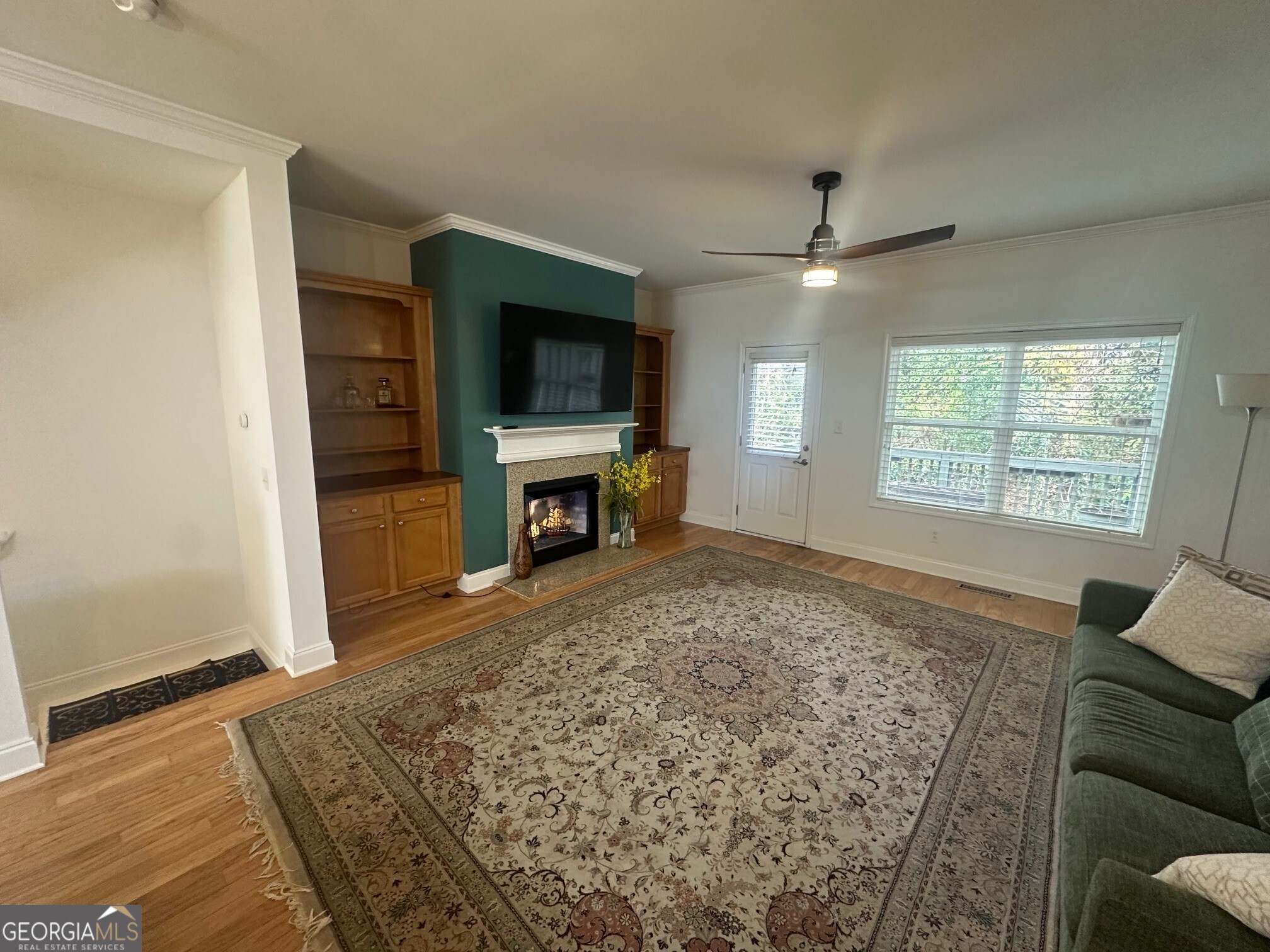 3060 Lauren Parc Road Decatur, GA 30032 - Photo 14 of 34 a living room with furniture a flat screen tv and a fireplace