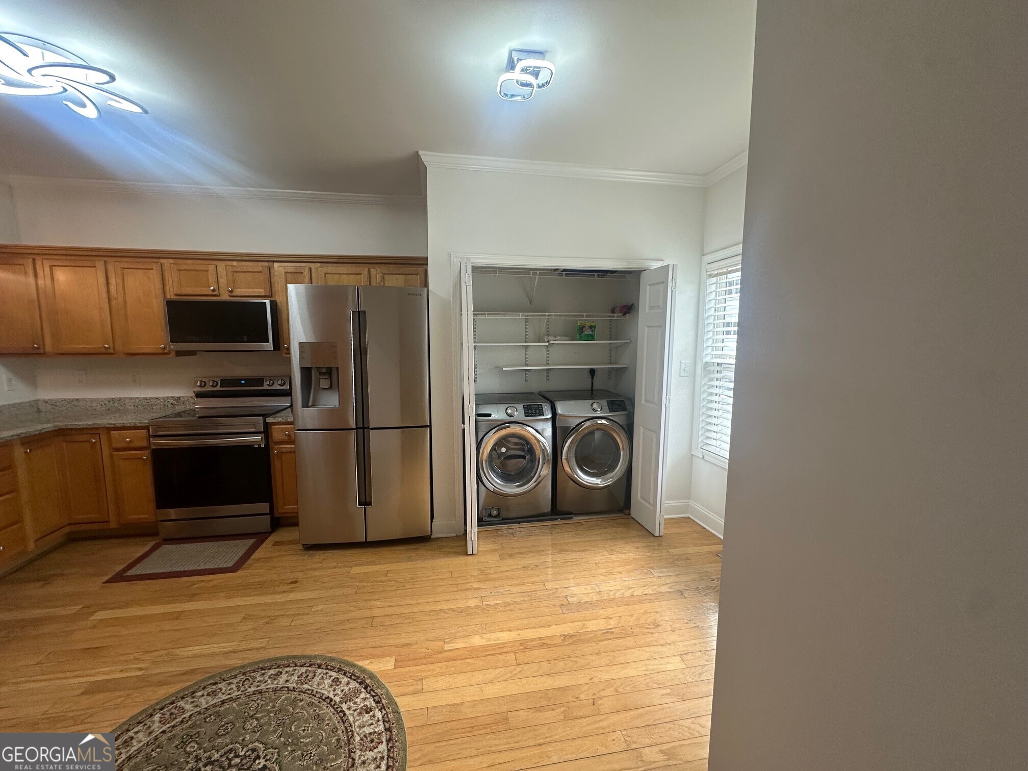 3060 Lauren Parc Road Decatur, GA 30032 - Photo 19 of 34 a kitchen with a refrigerator and a stove top oven