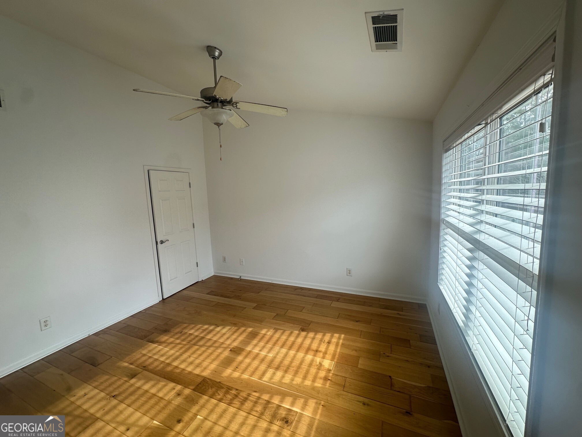 3060 Lauren Parc Road Decatur, GA 30032 - Photo 26 of 34 a view of empty room with wooden floor and fan