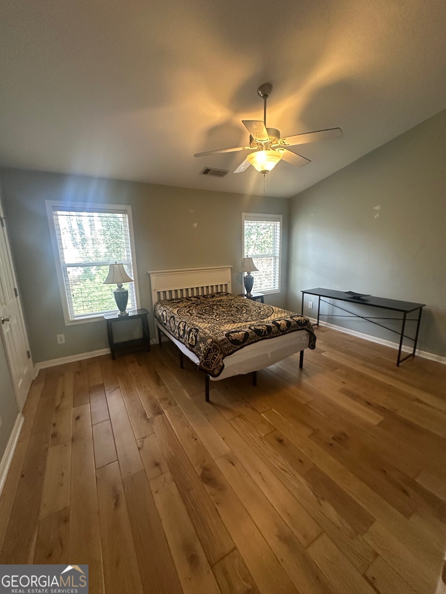 3060 Lauren Parc Road Decatur, GA 30032 - Photo 29 of 34 a living room with hard wood floors and a ceiling fan