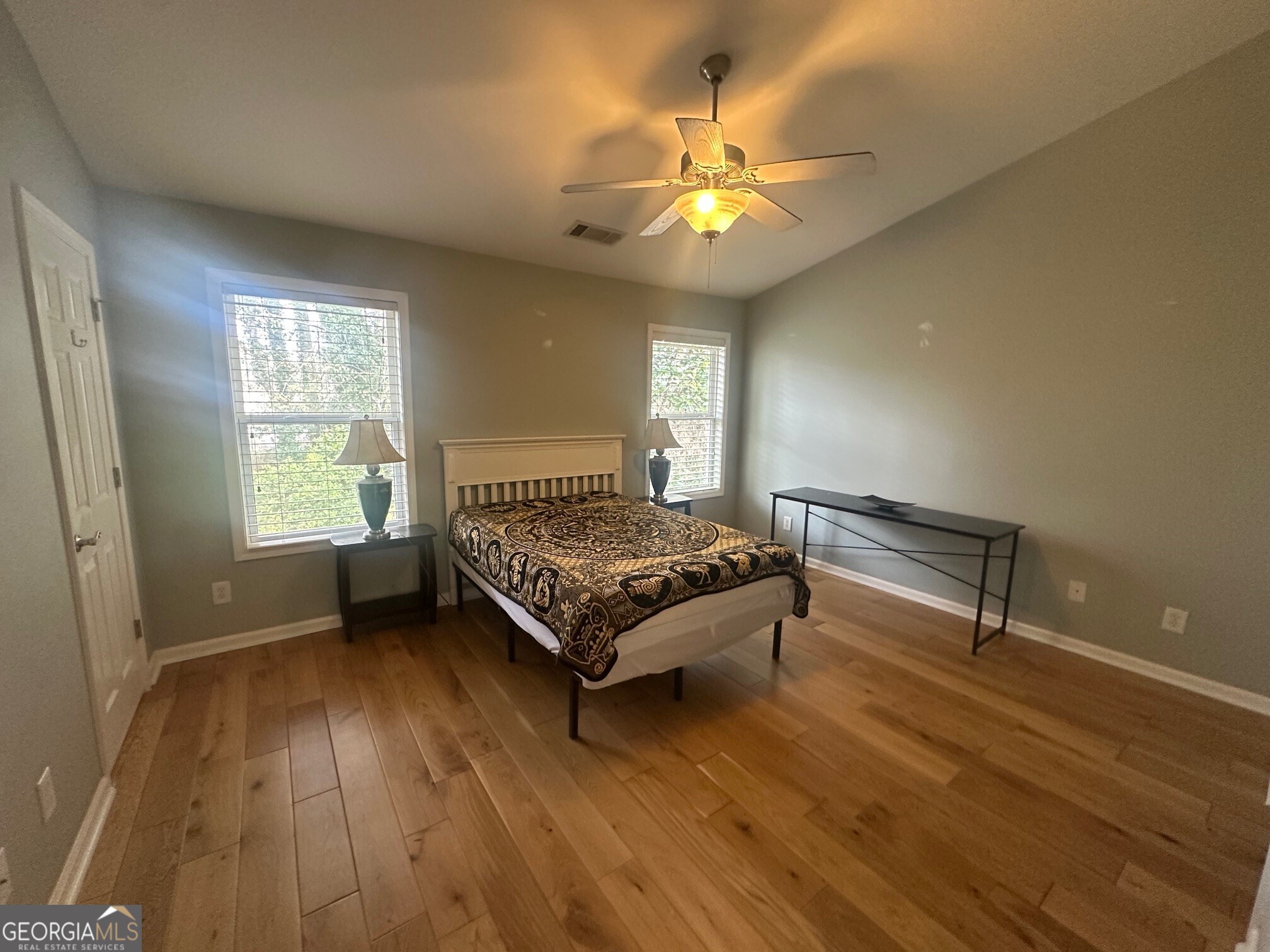 3060 Lauren Parc Road Decatur, GA 30032 - Photo 30 of 34 a bedroom with a bed and a chandelier