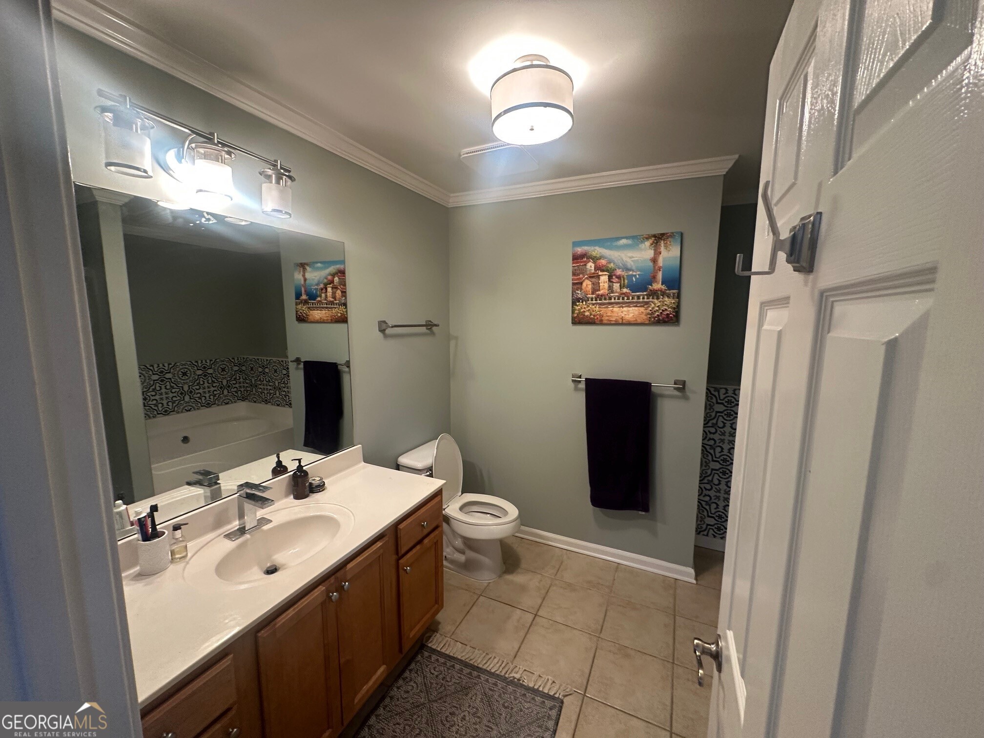 3060 Lauren Parc Road Decatur, GA 30032 - Photo 33 of 34 a bathroom with a double vanity sink and a mirror