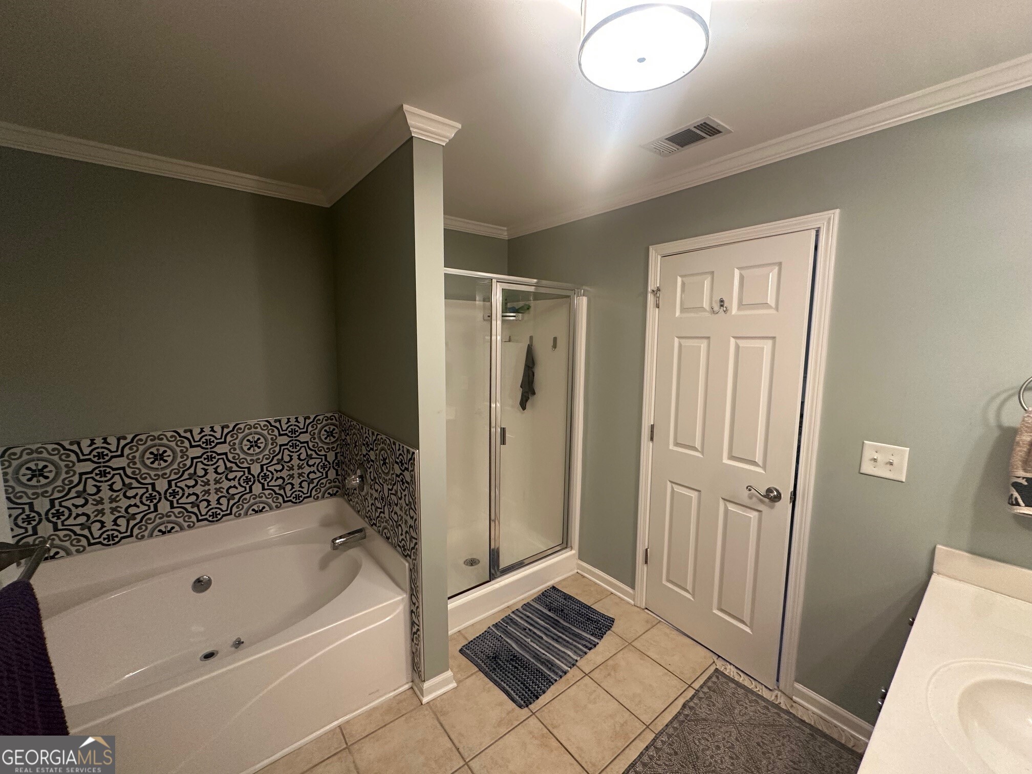 3060 Lauren Parc Road Decatur, GA 30032 - Photo 34 of 34 a bathroom with a tub a sink and a shower