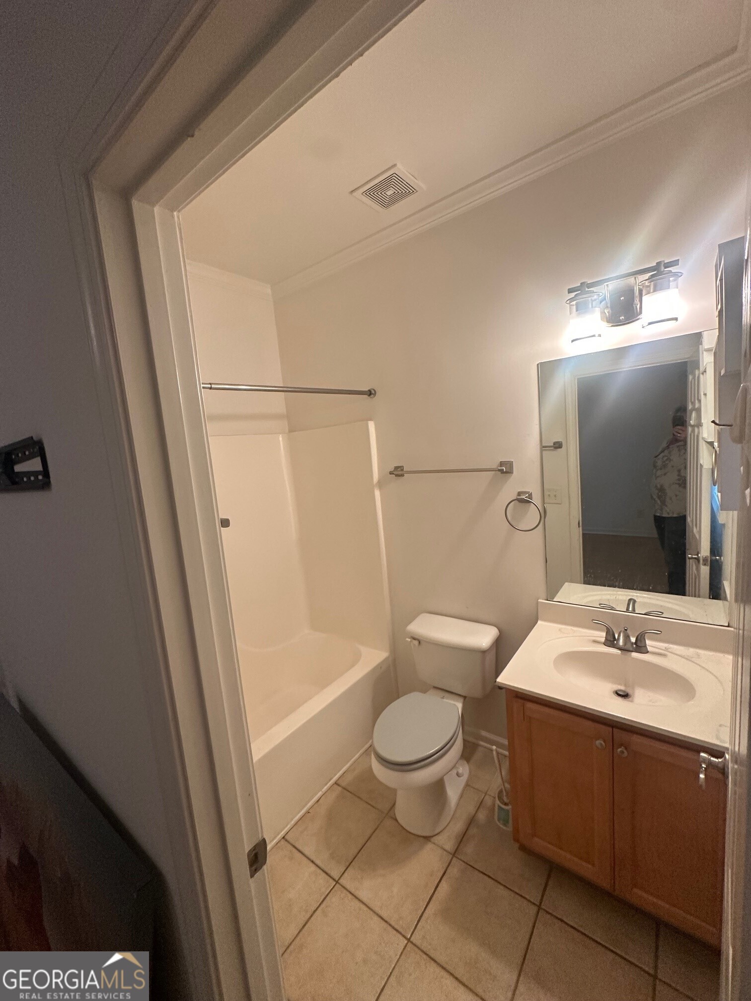 3060 Lauren Parc Road Decatur, GA 30032 - Photo 8 of 34 a bathroom with a sink toilet a mirror and shower