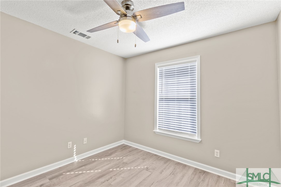 103 Laurel Pointe Drive Springfield, GA 31329 - Photo 9 of 12 Guest Bedroom 2 & 3 are almost identical.