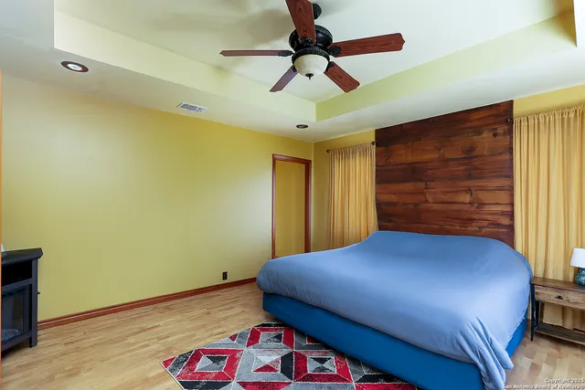 a bedroom with a bed and a dresser