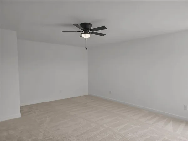 a view of a big room with carpet