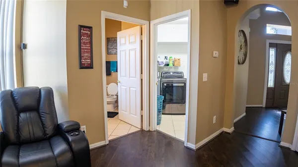 a room with furniture and wooden floor