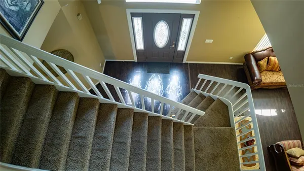 a view of an entryway with wooden floor