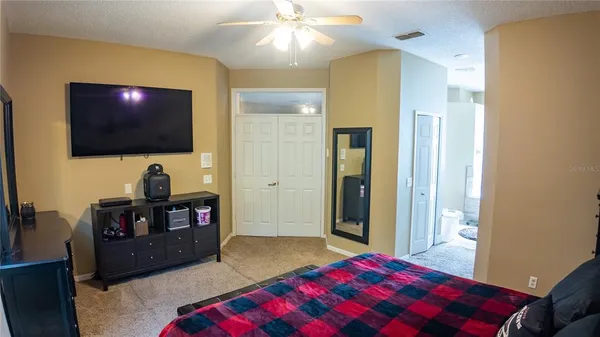 a view of room with wooden floor and closet