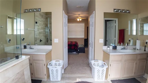 a bathroom with a tub sink and a mirror