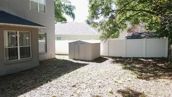 an aerial view of a house with a yard and garden