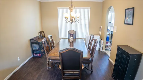 a view of a dining room with furniture and wooden floor