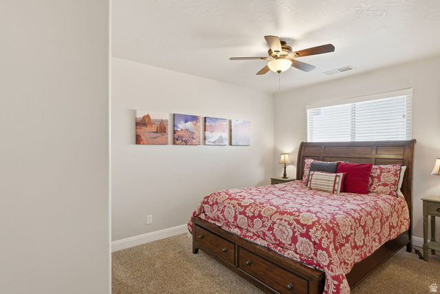 4269 Razor Drive Washington, UT 84780 - Photo 22 of 50 Carpeted bedroom featuring ceiling fan and baseboards