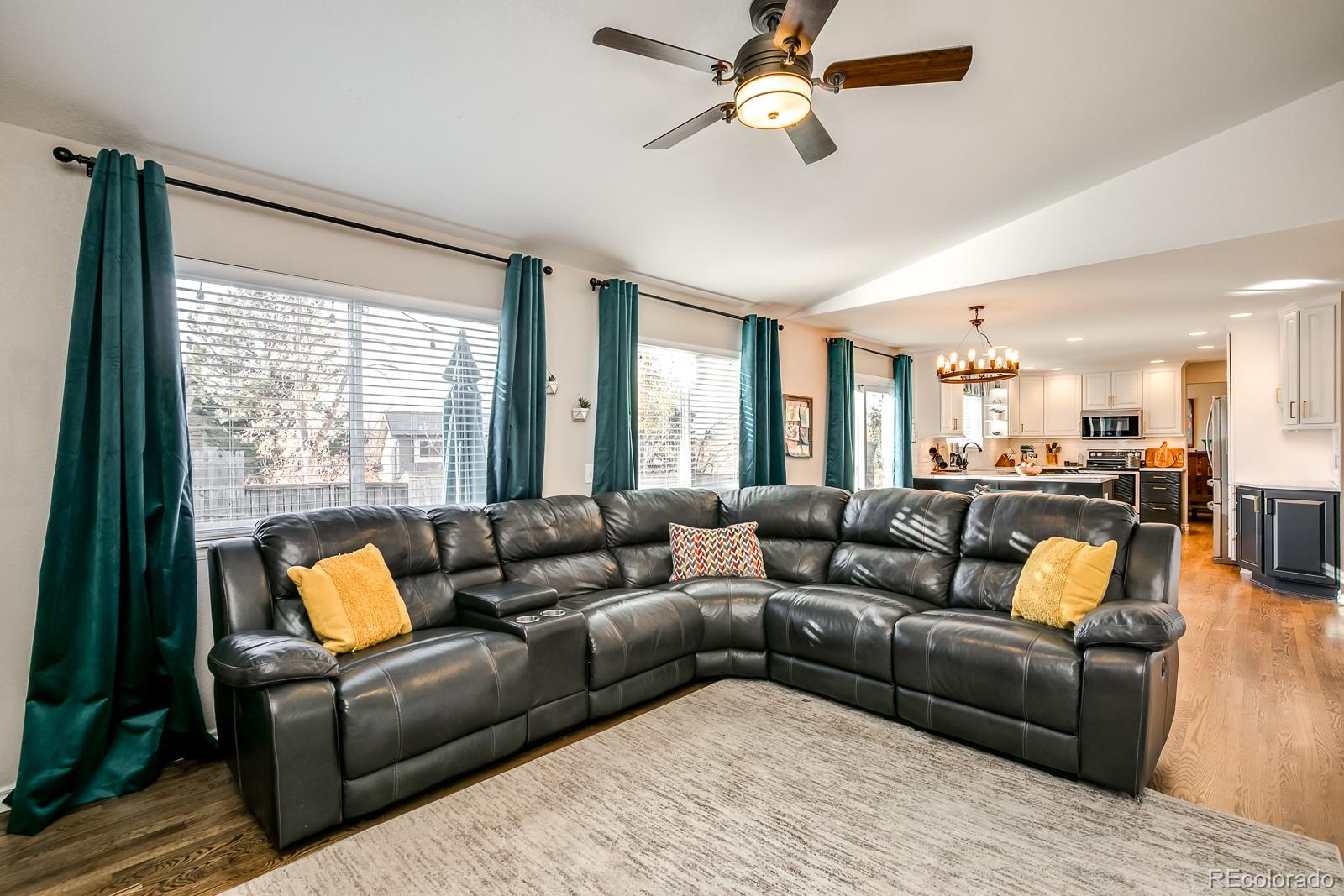 726 Northridge Road Highlands Ranch, CO 80126 - Photo 19 of 40 a living room with furniture and a large window