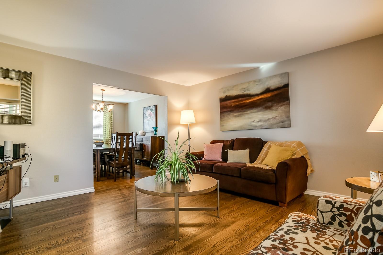 726 Northridge Road Highlands Ranch, CO 80126 - Photo 4 of 40 a living room with furniture and wooden floor