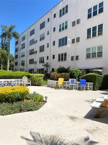 a view of a building with backyard