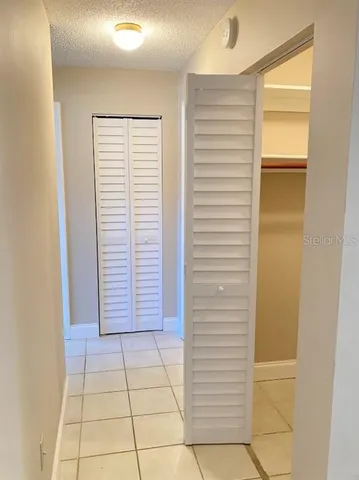 a view of wooden floor and windows in a room