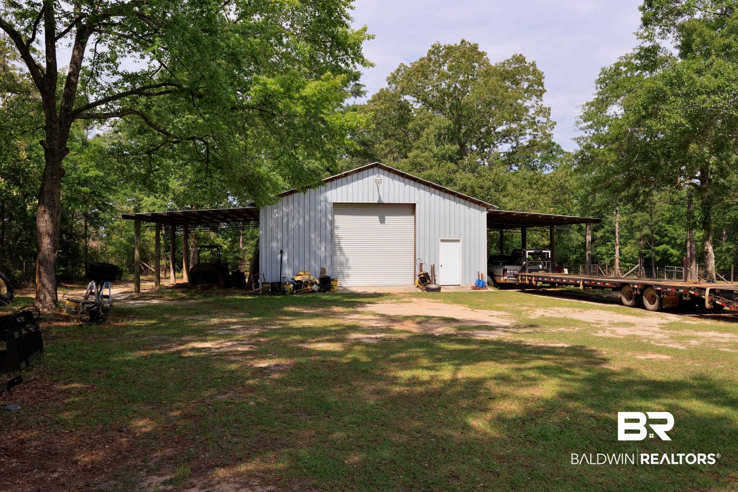 6725 Upper Creek Road Flomaton, AL 36441 - Photo 26 of 61 View of outbuilding featuring an outdoor structure and driveway
