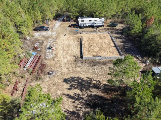 a view of a backyard with sitting area