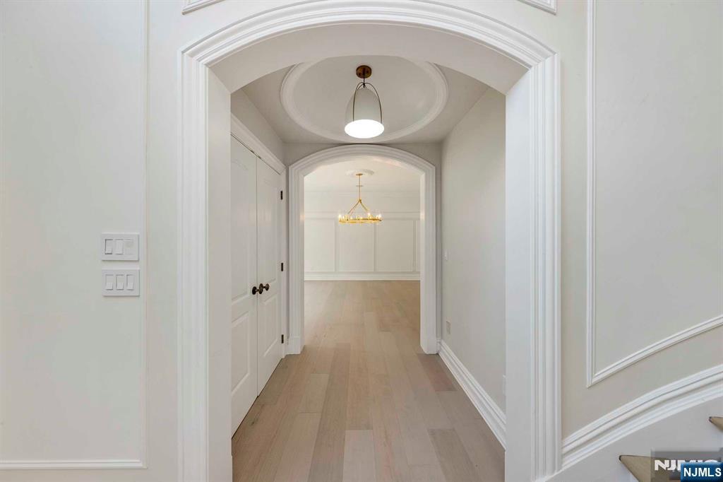 5 Ellen's Way Alpine, NJ 07620 - Photo 17 of 49 a view of a hallway with wooden floor and a door